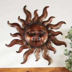 Metal Sun Wall Decor With Smiling Face And Curved Rays Copper - Olivia & May 15 Metal Sun Wall Decor With Smiling Face And Curved Rays Copper - Olivia & May -Adesso Store GUEST 9f84a532 e48a 4d8a 84e2 d93b3ebff526